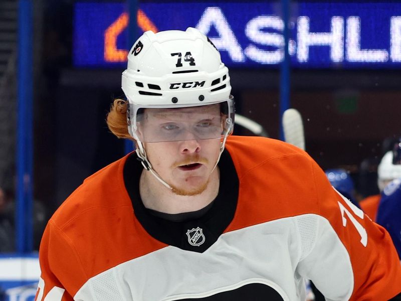 Nov 7, 2024; Tampa, Florida, USA; Philadelphia Flyers right wing Owen Tippett (74) tracks the puck during during the first period at Tampa Bay Lightningat Amalie Arena. Mandatory Credit: Kim Klement Neitzel-Imagn Images