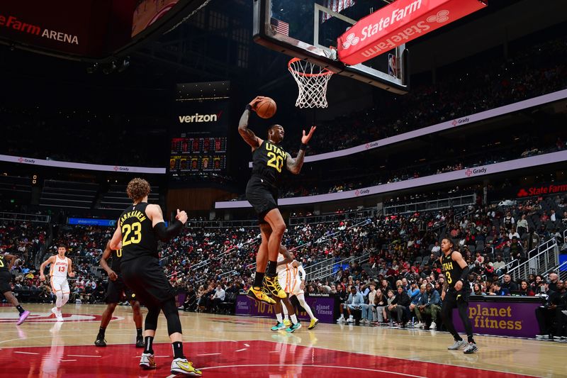 ATLANTA, GA - FEBRUARY 27: John Collins #20 of the Utah Jazz grabs a rebound during the game against the Atlanta Hawks on February 27, 2024 at State Farm Arena in Atlanta, Georgia.  NOTE TO USER: User expressly acknowledges and agrees that, by downloading and/or using this Photograph, user is consenting to the terms and conditions of the Getty Images License Agreement. Mandatory Copyright Notice: Copyright 2024 NBAE (Photo by Scott Cunningham/NBAE via Getty Images)