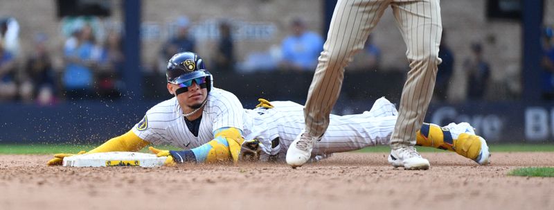 Aug 27, 2023; Milwaukee, Wisconsin, USA; Milwaukee Brewers catcher William Contreras (24) slides safely in for a double against the San Diego Padres in the seventh inning at American Family Field. Mandatory Credit: Michael McLoone-USA TODAY Sports