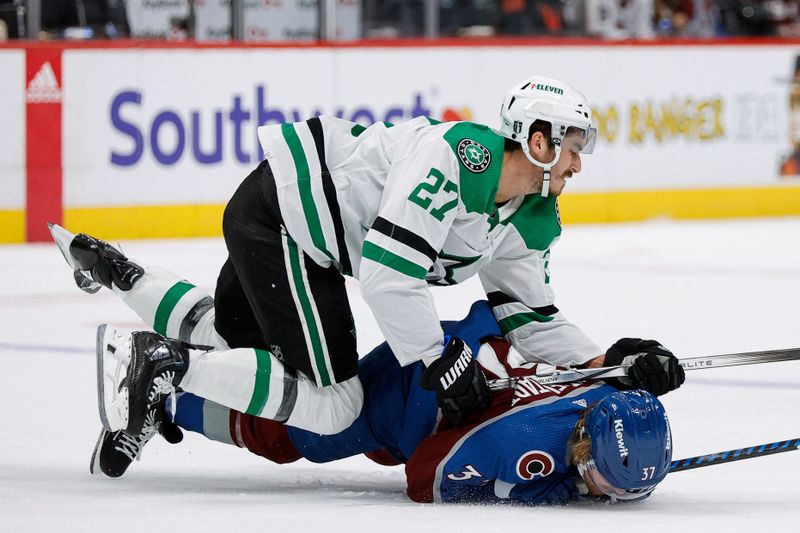 May 11, 2024; Denver, Colorado, USA; Colorado Avalanche center Casey Mittelstadt (37) is hit by Dallas Stars left wing Mason Marchment (27) in the first period in game three of the second round of the 2024 Stanley Cup Playoffs at Ball Arena. Mandatory Credit: Isaiah J. Downing-USA TODAY Sports