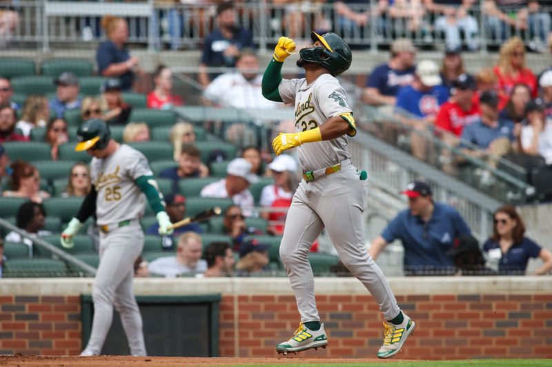 Jun 1, 2024; Atlanta, Georgia, USA; Oakland Athletics left fielder Miguel Andujar (22) celebrates after a three-run home run against the Atlanta Braves in the second inning at Truist Park. Mandatory Credit: Brett Davis-USA TODAY Sports