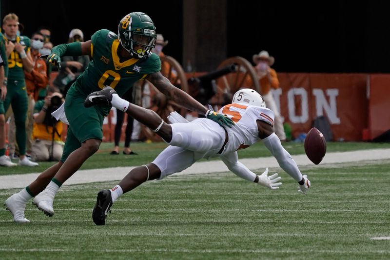 Oct 24, 2020; Austin, Texas, USA; Texas Longhorns defensive back Chris Brown (15) breaks up a pass intended for Baylor Bears wide receiver R.J. Sneed (00) in the first quarter at Darrell K Royal-Texas Memorial Stadium. Mandatory Credit: Scott Wachter-USA TODAY Sports