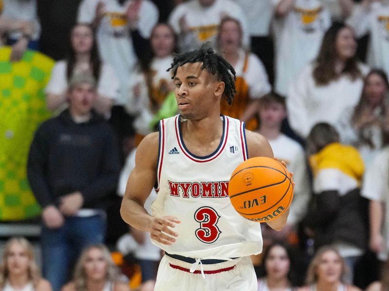 Jan 27, 2024; Laramie, Wyoming, USA; Wyoming Cowboys guard Sam Griffin (3) brings the ball up court against the Colorado State Rams during overtime at Arena-Auditorium. Mandatory Credit: Troy Babbitt-USA TODAY Sports