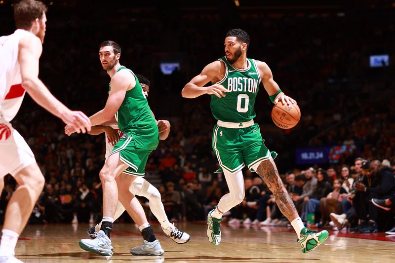 TORONTO, CANADA - OCTOBER 15: Jayson Tatum #0 of the Boston Celtics dribbles the ball during the game against the Toronto Raptors on October 15, 2024 at the Scotiabank Arena in Toronto, Ontario, Canada.  NOTE TO USER: User expressly acknowledges and agrees that, by downloading and or using this Photograph, user is consenting to the terms and conditions of the Getty Images License Agreement.  Mandatory Copyright Notice: Copyright 2024 NBAE (Photo by Vaughn Ridley/NBAE via Getty Images)