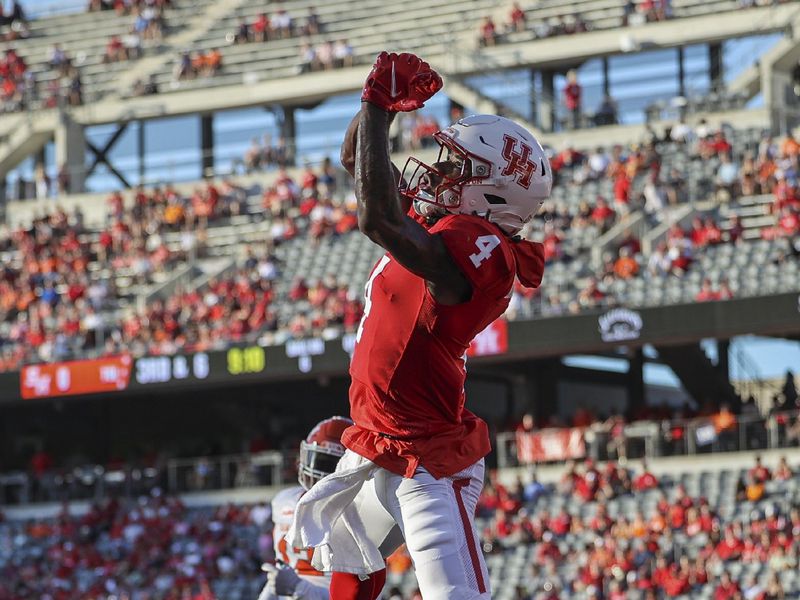 Sep 23, 2023; Houston, Texas, USA; Houston Cougars wide receiver Samuel Brown (4) is unable to make a catch for a reception during the first half against the Sam Houston State Bearkats at TDECU Stadium. Mandatory Credit: Troy Taormina-USA TODAY Sports