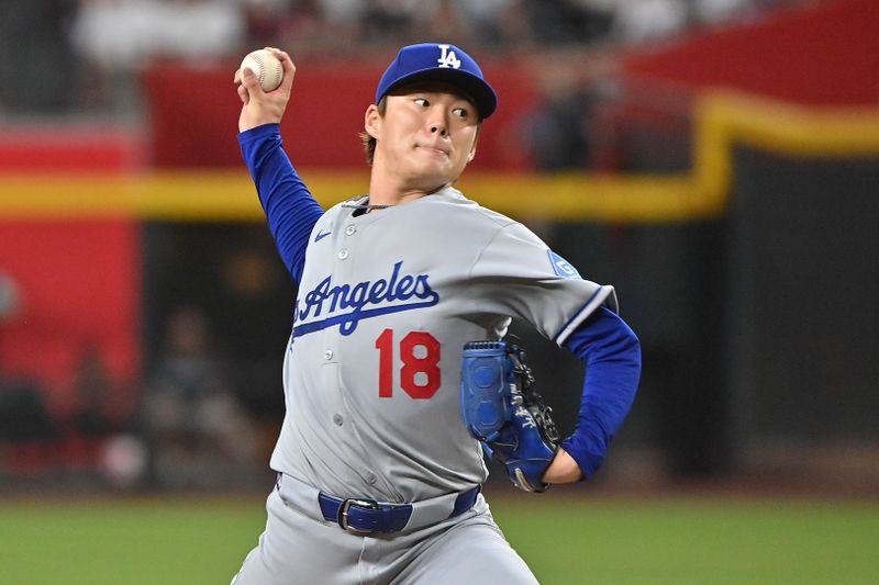 May 8, 2025; Phoenix, Arizona, USA; Los Angeles Dodgers pitcher Yoshinobu Yamamoto (18) throws in the fourth inning against the Los Angeles Dodgers at Chase Field. Mandatory Credit: Matt Kartozian-Imagn Images