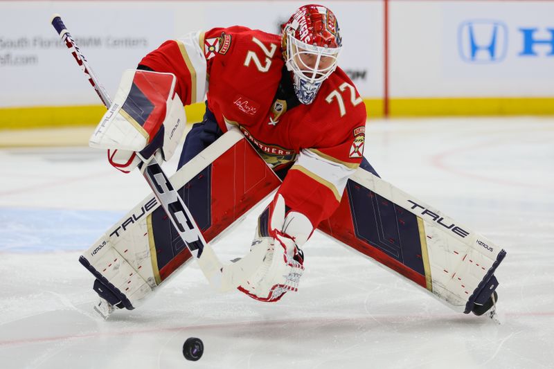 Apr 23, 2024; Sunrise, Florida, USA; Florida Panthers goaltender Sergei Bobrovsky (72) clears the puck away from his net against the Tampa Bay Lightning during the first period in game two of the first round of the 2024 Stanley Cup Playoffs at Amerant Bank Arena. Mandatory Credit: Sam Navarro-USA TODAY Sports