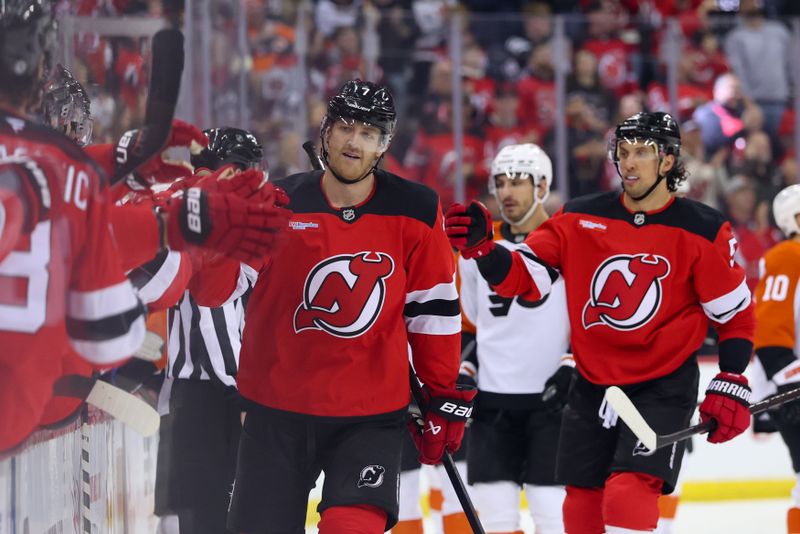 Jan 18, 2025; Newark, New Jersey, USA; New Jersey Devils defenseman Dougie Hamilton (7) celebrates his goal against the Philadelphia Flyers during the first period at Prudential Center. Mandatory Credit: Ed Mulholland-Imagn Images