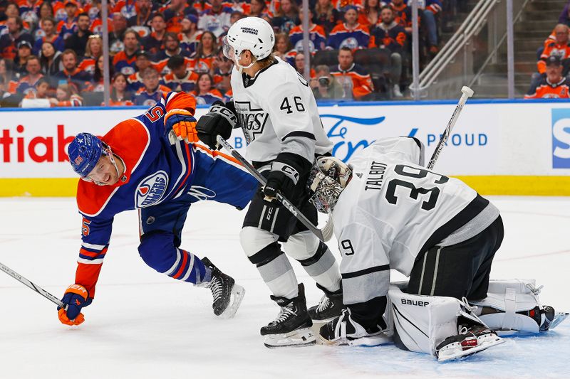 Apr 22, 2024; Edmonton, Alberta, CAN; Los Angeles Kings forward Blake Lizotte (46) trips up Edmonton Oilers forward Dylan Holloway (55) during the third period in game one of the first round of the 2024 Stanley Cup Playoffs at Rogers Place. Mandatory Credit: Perry Nelson-USA TODAY Sports