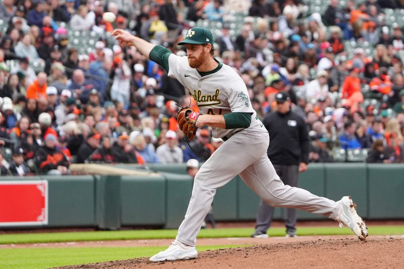 Apr 27, 2024; Baltimore, Maryland, USA; Oakland Athletics pitcher Michael Kelly (47) delivers a pitch against the Baltimore Orioles during the seventh inning at Oriole Park at Camden Yards. Mandatory Credit: Gregory Fisher-USA TODAY Sports