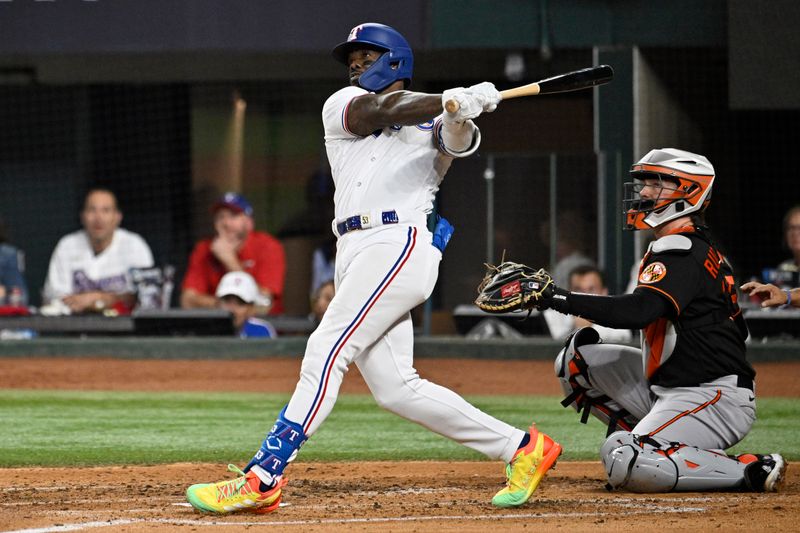 Oct 10, 2023; Arlington, Texas, USA; Texas Rangers right fielder Adolis Garcia (53) hits a three run home run against the Baltimore Orioles in the second inning during game three of the ALDS for the 2023 MLB playoffs at Globe Life Field. Mandatory Credit: Jerome Miron-USA TODAY Sports