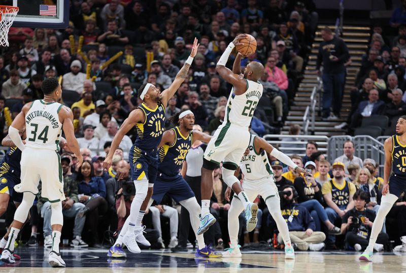 INDIANAPOLIS, INDIANA - JANUARY 03: Khris Middleton #22 of the Milwaukee Bucks shoots the ball against the Indiana Pacers at Gainbridge Fieldhouse on January 03, 2024 in Indianapolis, Indiana.    NOTE TO USER: User expressly acknowledges and agrees that, by downloading and or using this photograph, User is consenting to the terms and conditions of the Getty Images License Agreement.  (Photo by Andy Lyons/Getty Images)