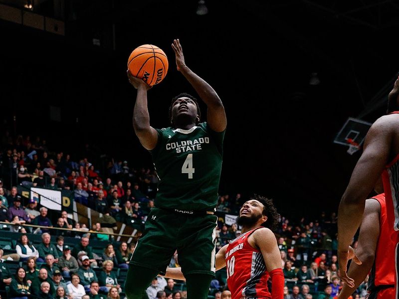 Mar 3, 2023; Fort Collins, Colorado, USA; Colorado State Rams guard Isaiah Stevens (4) drives to the net against New Mexico Lobos guard Jaelen House (10) in the second half at Moby Arena. Mandatory Credit: Isaiah J. Downing-USA TODAY Sports