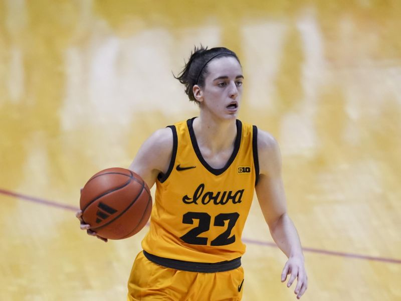 Feb 22, 2024; Bloomington, Indiana, USA;  Iowa Hawkeyes guard Caitlin Clark (22) dribbles the ball against the Indiana Hoosiers in the first half at Simon Skjodt Assembly Hall. Mandatory Credit: Aaron Doster-USA TODAY Sports