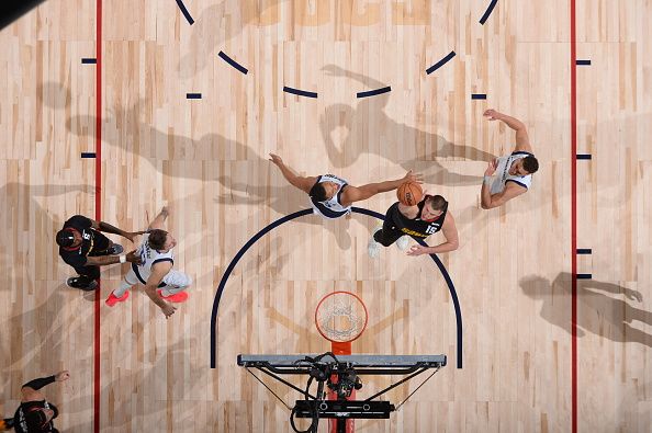 DENVER, CO - DECEMBER 18: Nikola Jokic #15 of the Denver Nuggets drives to the basket during the game against the Dallas Mavericks on December 18, 2023 at the Ball Arena in Denver, Colorado. NOTE TO USER: User expressly acknowledges and agrees that, by downloading and/or using this Photograph, user is consenting to the terms and conditions of the Getty Images License Agreement. Mandatory Copyright Notice: Copyright 2023 NBAE (Photo by Bart Young/NBAE via Getty Images)