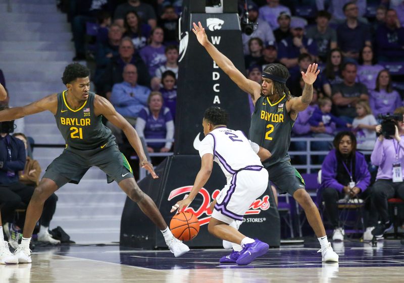 Jan 16, 2024; Manhattan, Kansas, USA; Kansas State Wildcats guard Tylor Perry (2) is guarded by Baylor Bears guard Jayden Nunn (2) and center Yves Missi (21) during the second half at Bramlage Coliseum. Mandatory Credit: Scott Sewell-USA TODAY Sports