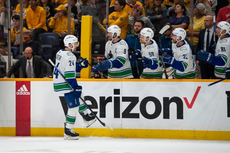 May 3, 2024; Nashville, Tennessee, USA; Vancouver Canucks center Pius Suter (24) celebrates his goal against the Nashville Predators during the third period in game six of the first round of the 2024 Stanley Cup Playoffs at Bridgestone Arena. Mandatory Credit: Steve Roberts-USA TODAY Sports