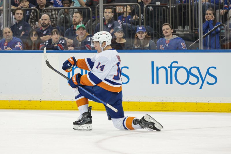 Mar 17, 2024; New York, New York, USA; New York Islanders center Bo Horvat (14) celebrates his goal during the first period against the New York Rangers at Madison Square Garden. Mandatory Credit: Vincent Carchietta-USA TODAY Sports