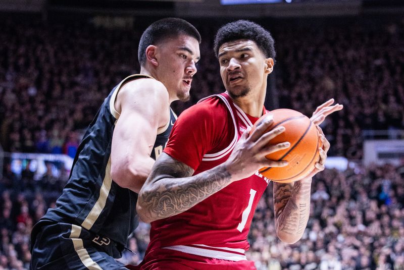 Feb 10, 2024; West Lafayette, Indiana, USA; Indiana Hoosiers center Kel'el Ware (1) moves to shoot the ball while Purdue Boilermakers center Zach Edey (15) defends in the first half at Mackey Arena. Mandatory Credit: Trevor Ruszkowski-USA TODAY Sports