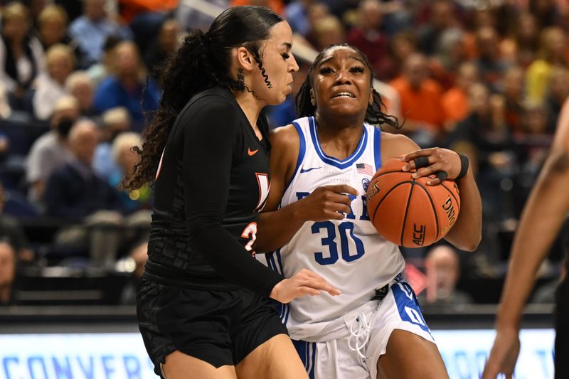 Mar 4, 2023; Greensboro, NC, USA; Duke Blue Devils guard Shayeann Day-Wilson (30) drives against Virginia Tech Hokies guard Kayana Traylor (23) during the second half at Greensboro Coliseum. Mandatory Credit: William Howard-USA TODAY Sports