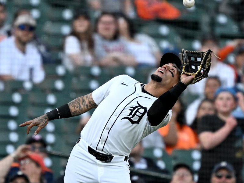 May 27, 2025; Detroit, Michigan, USA;  Detroit Tigers third baseman Javier Báez (28) catches an infield pop up against the San Francisco Giants in the fifth inning at Comerica Park. Mandatory Credit: Lon Horwedel-Imagn Images