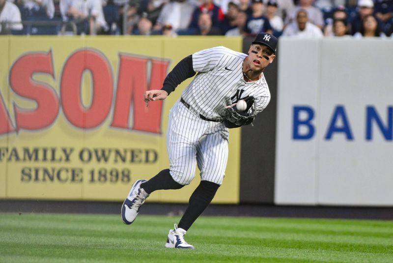 Jun 8, 2025; Bronx, New York, USA; New York Yankees outfielder Aaron Judge (99) catches a fly ball hit by Boston Red Sox outfielder Rob Refsnyder (not pictured) during the fourth inning at Yankee Stadium. Mandatory Credit: John Jones-Imagn Images