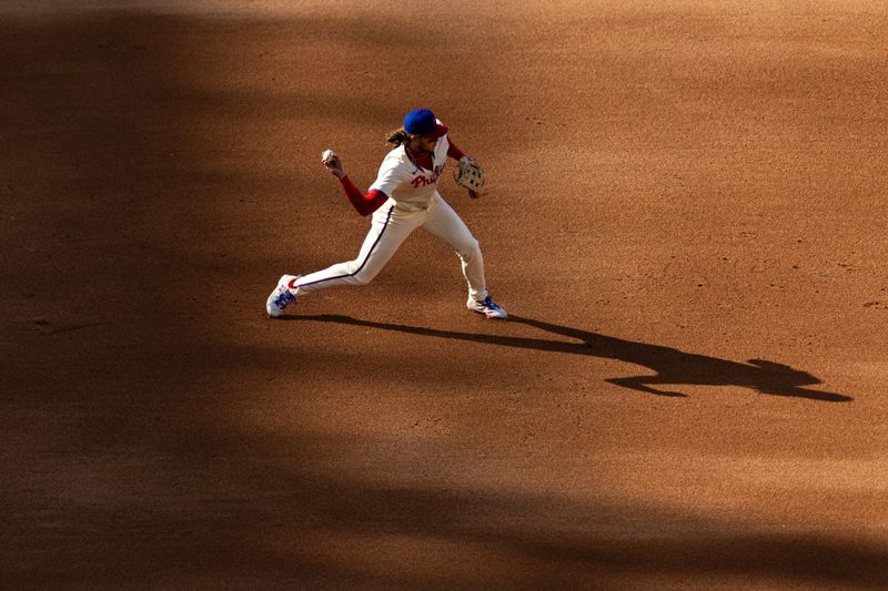 Apr 13, 2024; Philadelphia, Pennsylvania, USA; Philadelphia Phillies third base Alec Bohm (28) throws out Pittsburgh Pirates outfielder Edward Olivares (not pictured) at second during the fourth inning against the Pittsburgh Pirates at Citizens Bank Park. Mandatory Credit: Bill Streicher-USA TODAY Sports