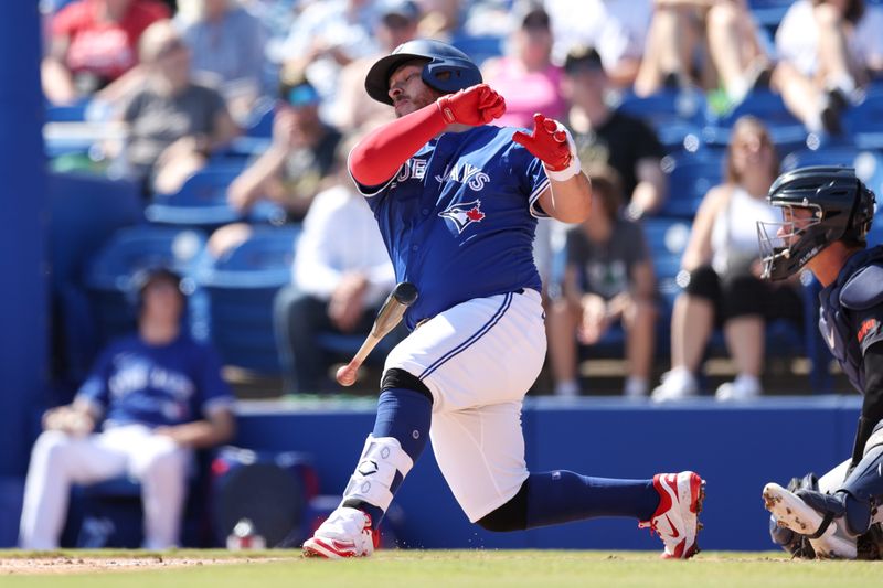 Feb 28, 2025; Dunedin, Florida, USA; Toronto Blue Jays catcher Alejandro Kirk (30) loses his bat on a swing against the Detroit Tigers in the second inning during spring training at TD Ballpark. Mandatory Credit: Nathan Ray Seebeck-Imagn Images