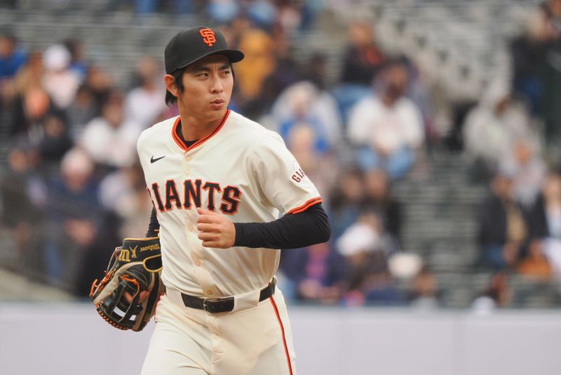 Apr 24, 2024; San Francisco, California, USA; San Francisco Giants center fielder Jung Hoo Lee (51) jogs to the dugout after the top of the sixth inning against the New York Mets at Oracle Park. Mandatory Credit: Kelley L Cox-USA TODAY Sports