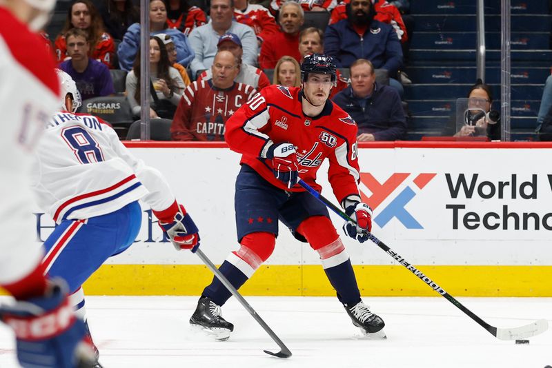 Oct 31, 2024; Washington, District of Columbia, USA; Washington Capitals left wing Pierre-Luc Dubois (80) skates with the puck as Montreal Canadiens defenseman Mike Matheson (8) defends in the first period at Capital One Arena. Mandatory Credit: Geoff Burke-Imagn Images