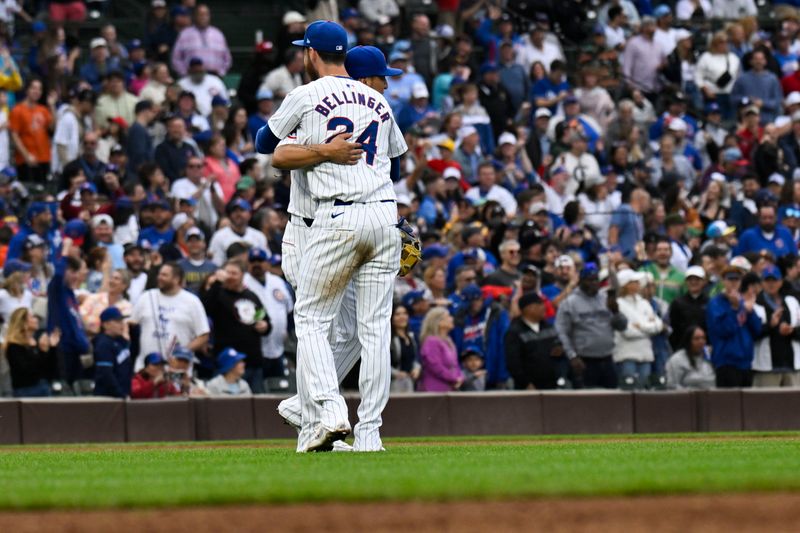 Sep 28, 2024; Chicago, Illinois, USA;  Chicago Cubs outfielder Cody Bellinger (24) hugs third baseman Isaac Paredes (17) after a game against the Cincinnati Reds at Wrigley Field. Mandatory Credit: Matt Marton-Imagn Images