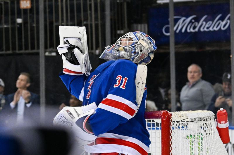 Jan 21, 2025; New York, New York, USA;  New York Rangers goaltender Igor Shesterkin (31) celebrates his shutout against the Ottawa Senators during the third period at Madison Square Garden. Mandatory Credit: Dennis Schneidler-Imagn Images