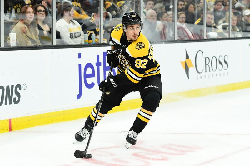 Apr 10, 2025; Boston, Massachusetts, USA;  Boston Bruins center Marat Khusnutdinov (92) controls the puck during the third period against the Chicago Blackhawks at TD Garden. Mandatory Credit: Bob DeChiara-Imagn Images
