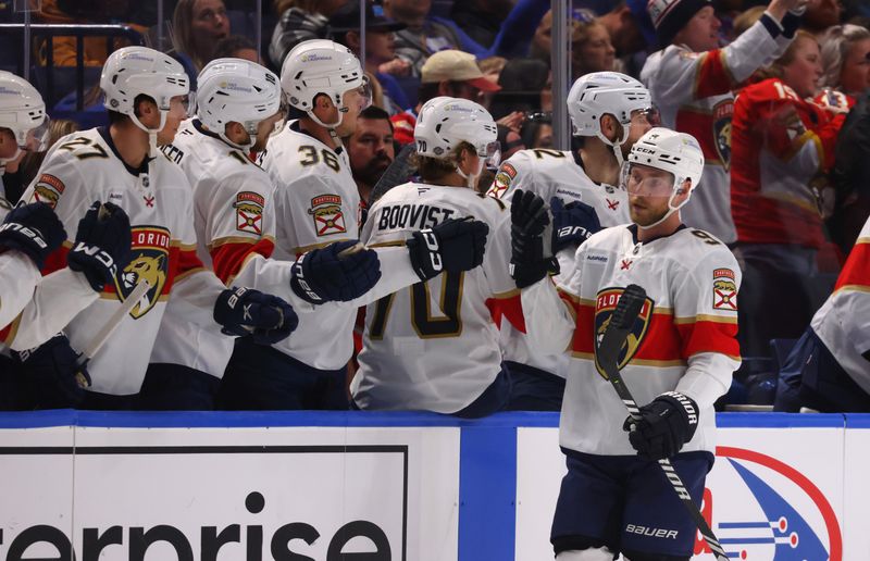 Oct 12, 2024; Buffalo, New York, USA;  Florida Panthers center Sam Bennett (9) celebrates his goal with teammates during the second period against the Buffalo Sabres at KeyBank Center. Mandatory Credit: Timothy T. Ludwig-Imagn Images