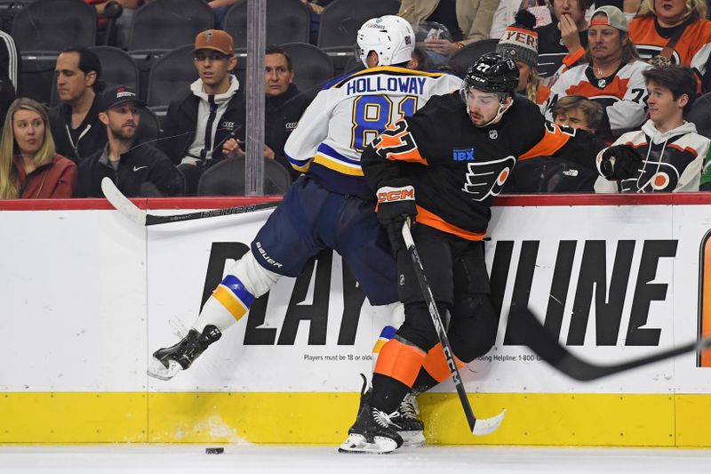 Oct 31, 2024; Philadelphia, Pennsylvania, USA; St. Louis Blues center Dylan Holloway (81) and Philadelphia Flyers left wing Noah Cates (27) battle for the puck during the first period at Wells Fargo Center. Mandatory Credit: Eric Hartline-Imagn Images