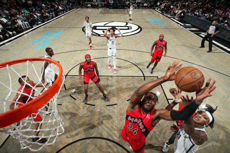 BROOKLYN, NY - OCTOBER 18: Bruno Fernando #24 of the Toronto Raptors rebounds the ball during the game on October 18, 2024 at Barclays Center in Brooklyn, New York. NOTE TO USER: User expressly acknowledges and agrees that, by downloading and or using this Photograph, user is consenting to the terms and conditions of the Getty Images License Agreement. Mandatory Copyright Notice: Copyright 2024 NBAE (Photo by Nathaniel S. Butler/NBAE via Getty Images)