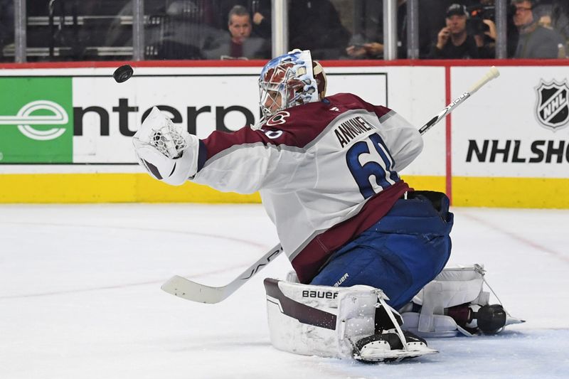 Nov 18, 2024; Philadelphia, Pennsylvania, USA; Colorado Avalanche goaltender Justus Annunen (60) makes a save against the Philadelphia Flyers during the third period at Wells Fargo Center. Mandatory Credit: Eric Hartline-Imagn Images