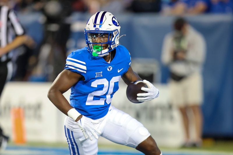 Oct 21, 2023; Provo, Utah, USA; Brigham Young Cougars running back Deion Smith (20) runs after a catch against the Texas Tech Red Raiders in the second half at LaVell Edwards Stadium. Mandatory Credit: Rob Gray-USA TODAY Sports