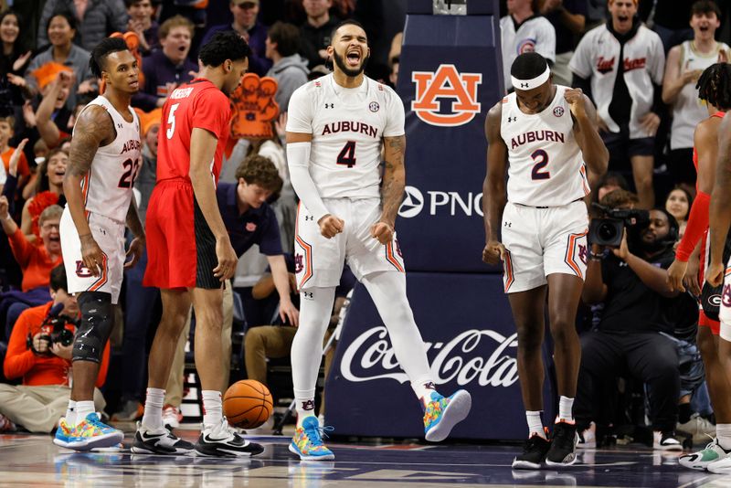 Feb 1, 2023; Auburn, Alabama, USA;  Auburn Tigers forward Johni Broome (4) reacts after being fouled while making a shot against the Georgia Bulldogs during the first half at Neville Arena. Mandatory Credit: John Reed-USA TODAY Sports