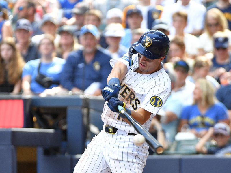 Jun 29, 2024; Milwaukee, Wisconsin, USA; Milwaukee Brewers outfielder Sal Frelick (10) gets a base hit against the Chicago Cubs in the fourth inning at American Family Field. Mandatory Credit: Michael McLoone-USA TODAY Sports