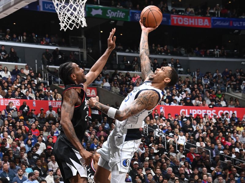 LOS ANGELES, CA - APRIL 23: PJ Washington #25 of the Dallas Mavericks drives to the basket during the game against the LA Clippers during Round 1 Game 2 of the 2024 NBA Playoffs on April 23, 2024 at Crypto.Com Arena in Los Angeles, California. NOTE TO USER: User expressly acknowledges and agrees that, by downloading and/or using this Photograph, user is consenting to the terms and conditions of the Getty Images License Agreement. Mandatory Copyright Notice: Copyright 2024 NBAE (Photo by Andrew D. Bernstein/NBAE via Getty Images)