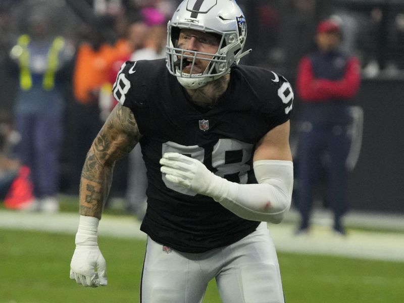 Las Vegas Raiders defensive end Maxx Crosby (98) rushes the quarterback during an NFL football game against the Houston Texans, Sunday, Oct 23, 2022, in Las Vegas. (AP Photo/Rick Scuteri)