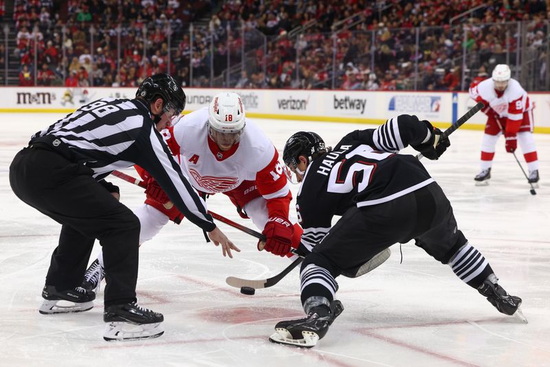 Dec 23, 2023; Newark, New Jersey, USA; New Jersey Devils left wing Erik Haula (56) and Detroit Red Wings center Andrew Copp (18) face-off during the third period at Prudential Center. Mandatory Credit: Ed Mulholland-USA TODAY Sports