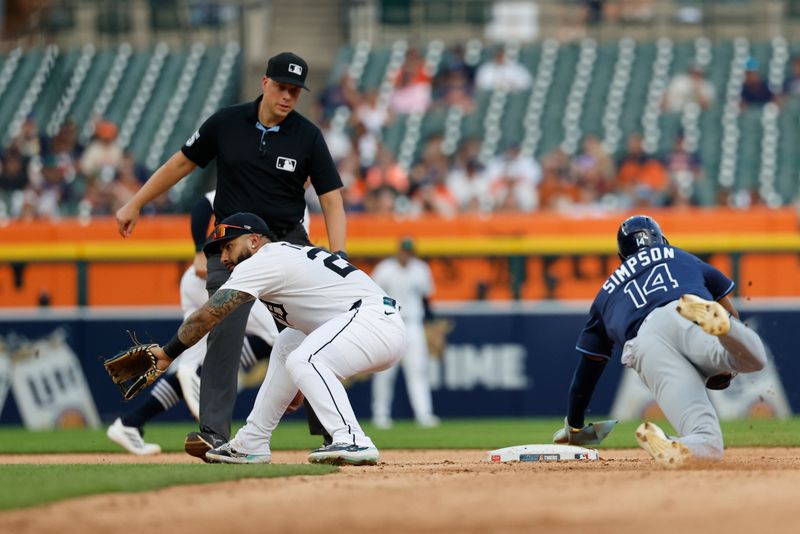 Jul 9, 2025; Detroit, Michigan, USA;  Tampa Bay Rays outfielder Chandler Simpson (14) steals second ahead of the throw to Detroit Tigers second baseman Gleyber Torres (25) in the fourth inning  in the fourth inning against the Detroit Tigers at Comerica Park. Mandatory Credit: Rick Osentoski-Imagn Images