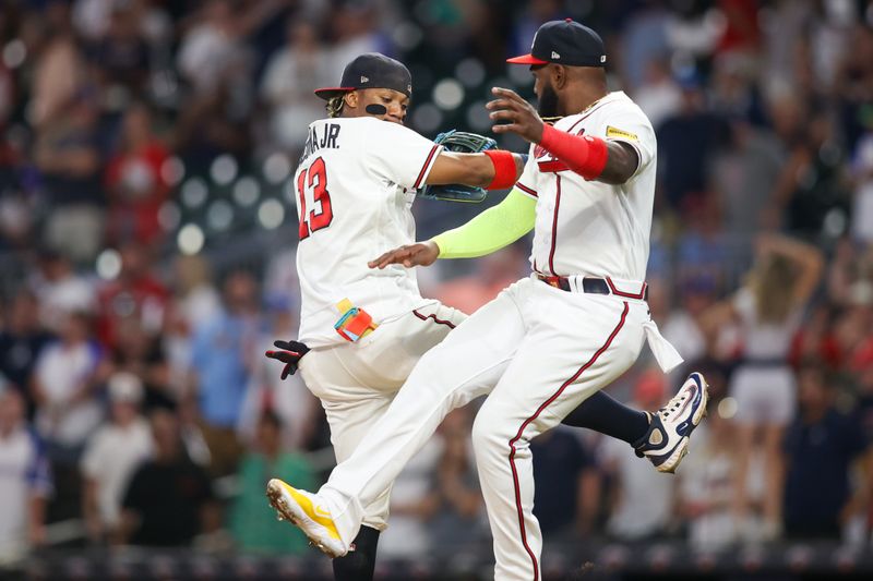 Sep 7, 2023; Atlanta, Georgia, USA; Atlanta Braves right fielder Ronald Acuna Jr. (13) and designated hitter Marcell Ozuna (20) celebrate after a victory against the St. Louis Cardinals at Truist Park. Mandatory Credit: Brett Davis-USA TODAY Sports
