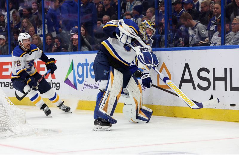 Dec 19, 2023; Tampa, Florida, USA; St. Louis Blues goaltender Joel Hofer (30) passes against the Tampa Bay Lightning during the third period at Amalie Arena. Mandatory Credit: Kim Klement Neitzel-USA TODAY Sports