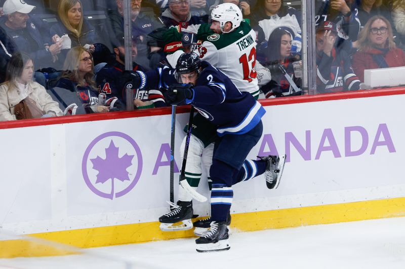 Nov 23, 2025; Winnipeg, Manitoba, CAN;  Winnipeg Jets defenseman Dylan DeMelo (2) boards Minnesota Wild forward Yakov Trenin (13) during the second period at Canada Life Centre. Mandatory Credit: Terrence Lee-Imagn Images
