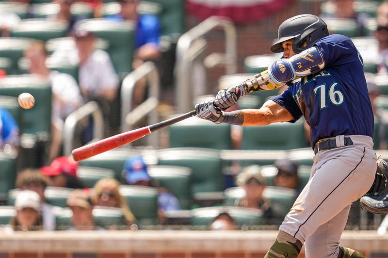 May 21, 2023; Cumberland, Georgia, USA; Seattle Mariners second baseman Jose Caballero (76) hits a home run against the Atlanta Braves during the eighth inning at Truist Park. Mandatory Credit: Dale Zanine-USA TODAY Sports