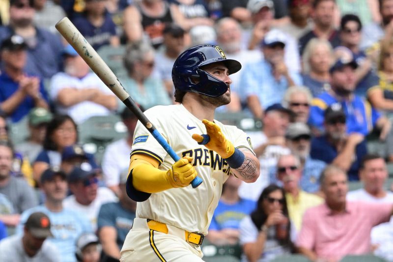 Aug 29, 2024; Milwaukee, Wisconsin, USA; Milwaukee Brewers right fielder Garrett Mitchell (5) watches after hitting a solo home run in the second inning against the San Francisco Giants at American Family Field. Mandatory Credit: Benny Sieu-USA TODAY Sports