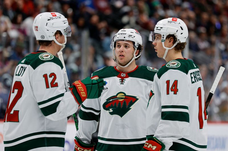 Apr 9, 2024; Denver, Colorado, USA; Minnesota Wild defenseman Brock Faber (7) and left wing Matt Boldy (12) and center Joel Eriksson Ek (14) in the first period against the Colorado Avalanche at Ball Arena. Mandatory Credit: Isaiah J. Downing-USA TODAY Sports